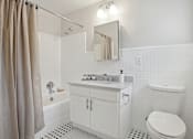 Thumbnail 12 of 25 - Bathroom with Ceramic Tile, Operable Window, and Deco Tub