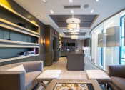 Thumbnail 10 of 41 - a living room and kitchen in a hotel room