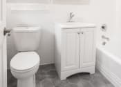 Thumbnail 13 of 22 - a small bathroom with a toilet and a sink