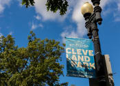 Thumbnail 24 of 34 - a sign on a street light