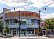 Thumbnail 17 of 20 - a large building with a giant corn sign on top of it on a city street