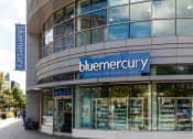 Thumbnail 19 of 20 - the facade of a building with a blueemedurgy sign on the side of it