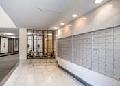 Thumbnail 18 of 22 - a long wall of lockers in a lobby of a building