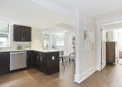 Thumbnail 10 of 35 - kitchen with black cabinets and a white counter top and a living room