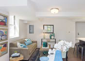Thumbnail 6 of 35 - living room with a couch and a table