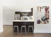 Thumbnail 8 of 35 - kitchen with a counter and three bar stools
