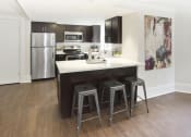 Thumbnail 9 of 35 - kitchen with a center island with three stools