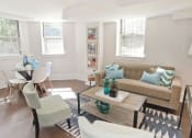 Thumbnail 7 of 35 - living room with a couch and chairs and a table