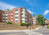 Thumbnail 3 of 27 - an apartment building on the corner of a street