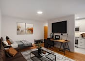 Thumbnail 35 of 35 - A modern living room with a brown couch and a black coffee table.