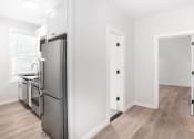 Thumbnail 8 of 22 - a renovated kitchen with stainless steel appliances in a new home