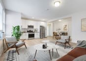 Thumbnail 6 of 22 - a living room with a couch and a table