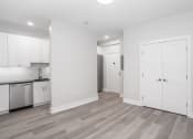 Thumbnail 12 of 35 - renovated kitchen with white cabinets and stainless steel appliances