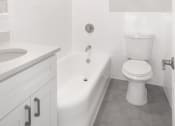 Thumbnail 16 of 35 - white bathroom with a toilet and a tub