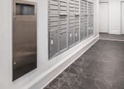Thumbnail 9 of 41 - a view of the mail room of a building with mailboxes on the wall