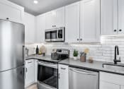 Thumbnail 10 of 41 - Stainless Steel Appliances, Quartz Counters & Custom Cabinetry
