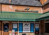 Thumbnail 38 of 41 - the front of a building with a sign that reads foundation fitness