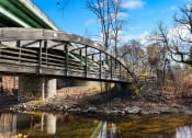 Thumbnail 35 of 35 - a bridge over a river on a sunny day