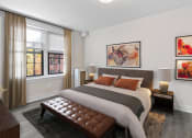 Thumbnail 22 of 41 - a bedroom with a bed and two windows