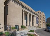 Thumbnail 1 of 41 - a large building with columns and a street in front of it