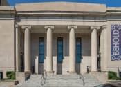 Thumbnail 2 of 41 - the front of a building with columns and stairs