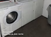Thumbnail 10 of 10 - A washing machine with a control panel and a digital display.