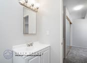 Thumbnail 14 of 17 - a bathroom with a sink and a mirror and a shower