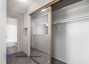 Thumbnail 12 of 17 - a mirror in a bathroom with a closet