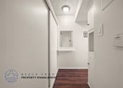 Thumbnail 8 of 17 - A hallway with a logo for Beach Front Property Management.