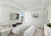 Thumbnail 5 of 33 - A bedroom with a large bed and a painting on the wall.