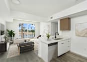 Thumbnail 2 of 33 - A modern kitchen with a large window overlooking a cityscape.