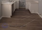 Thumbnail 7 of 10 - an empty kitchen with white cabinets and a sink