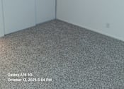 Thumbnail 7 of 10 - A room with a grey carpet and a white wall.