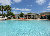 Thumbnail 27 of 40 - A large swimming pool with a blue tinted water.