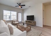 Thumbnail 6 of 65 - the living room of an apartment with a couch and a tv