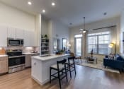 Thumbnail 22 of 23 - an open floor plan with a kitchen and living room
