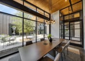 Thumbnail 12 of 22 - a conference room with large windows and a wooden ceiling