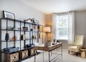 Thumbnail 6 of 16 - a home office with a desk and a shelving unit