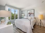 Thumbnail 13 of 66 - a bedroom with a large bed and two windows