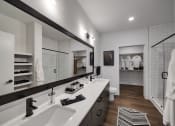 Thumbnail 6 of 22 - a bathroom with two sinks and a walk in shower in a 555 waverly unit