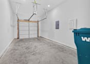 Thumbnail 27 of 33 - A room with a white wall and a blue dumpster.