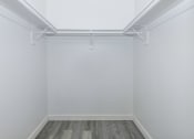 Thumbnail 10 of 22 - an empty room with white walls and a wood floor