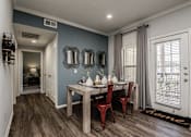 Thumbnail 6 of 28 - an image of a dining room with a table and chairs
