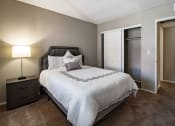 Thumbnail 7 of 20 - a bedroom with a bed and a closet
