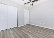 Thumbnail 6 of 20 - an empty room with white walls and a ceiling fan