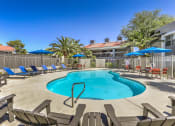 Thumbnail 15 of 20 - our resort style swimming pool is surrounded by chairs and umbrellas