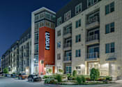Thumbnail 32 of 36 - A building with the word "LOVE" on it is lit up at night.