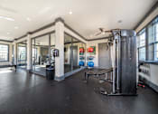 Thumbnail 21 of 29 - A spacious home gym with a variety of equipment.