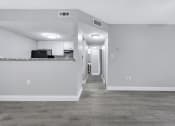 Thumbnail 3 of 33 - the living room and kitchen of an empty apartment