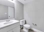 Thumbnail 16 of 33 - an empty bathroom with a toilet and a sink